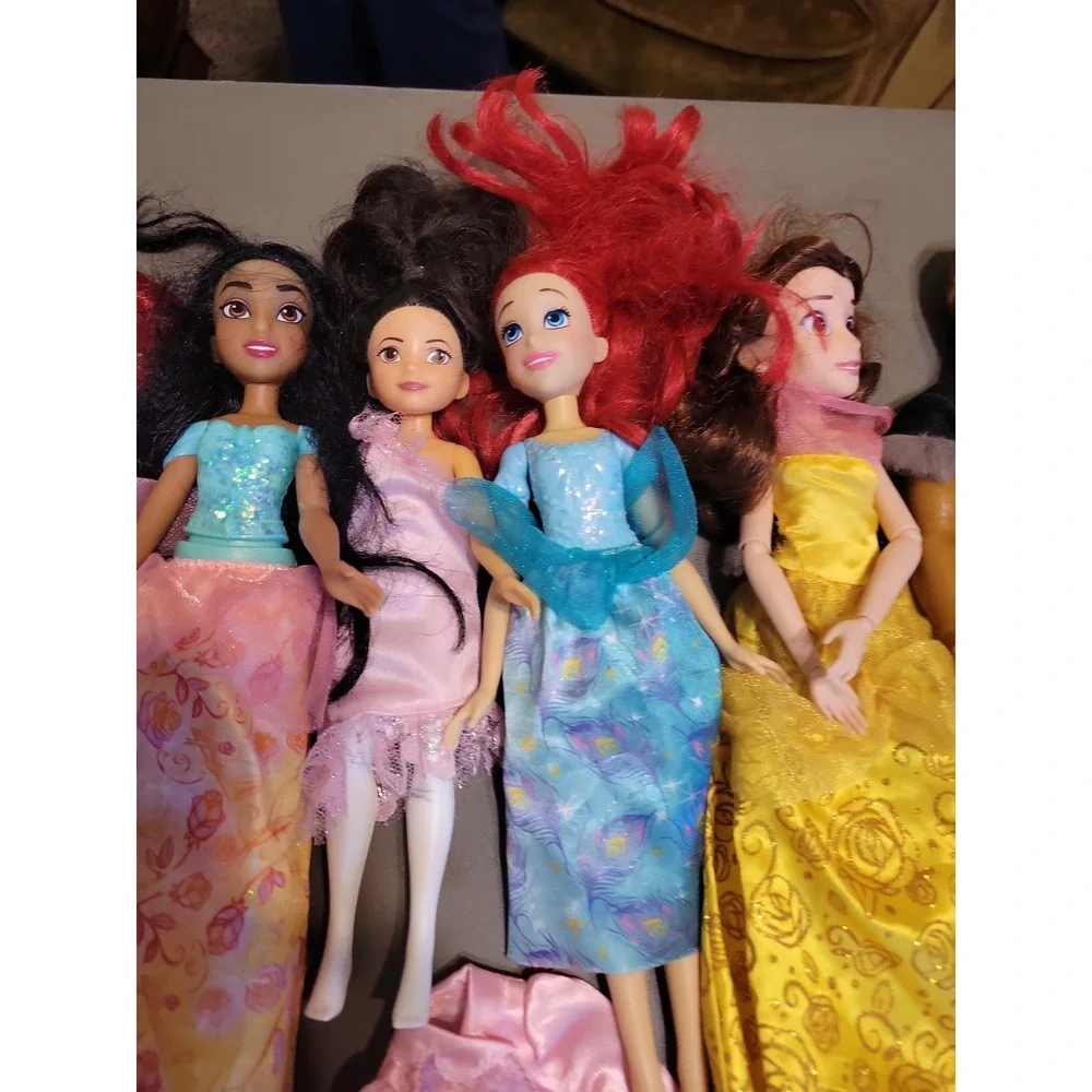 Disney Barbie dolls with extra dresses shoes etc... Mixed lot